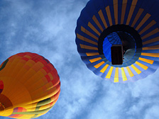 Looking up at two hot air balloons!
